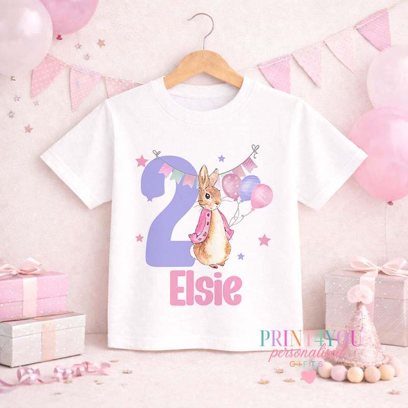 Close-up of the bunny print with personalised name and number 2 on the girls' birthday top