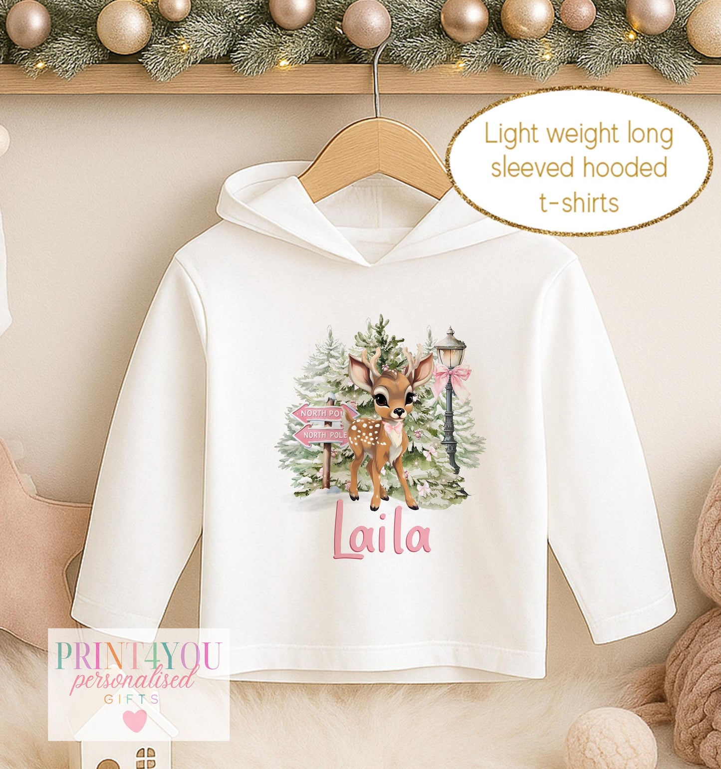 Personalised Christmas hooded t-shirt for girls, white lightweight long sleeved hoodie printed with a fawn among pink winter blooms and a name