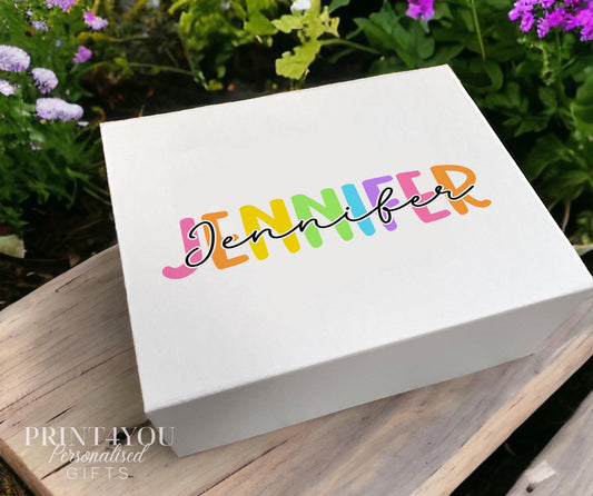 White magnetic gift box personalised with a name printed in a colourful rainbow palette