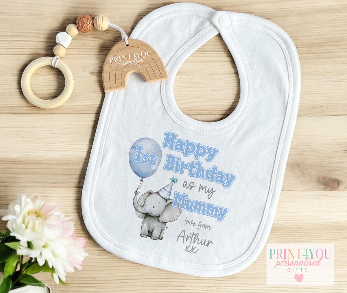 Cute Elephant personalised sleepsuit for a first birthday, printed with a blue balloon and custom name.