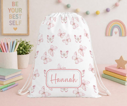 Personalised pink butterfly drawstring PE bag with the name Hannah printed on the front
