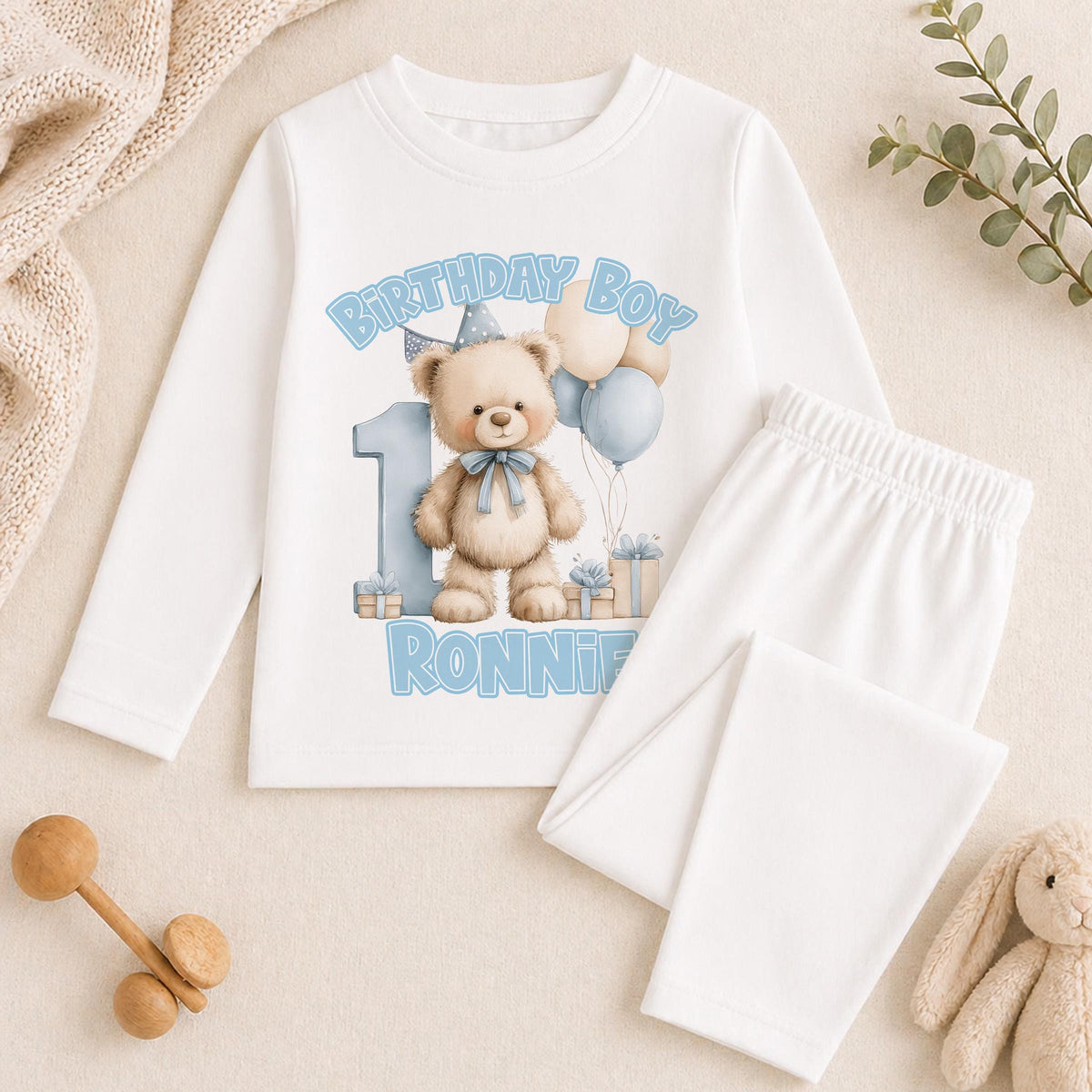 Personalised blue teddy bear 1st birthday pyjamas with the child's name printed on soft cotton