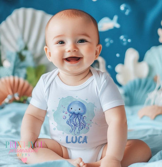 Personalised jellyfish baby bib, ocean theme, printed with baby's name.