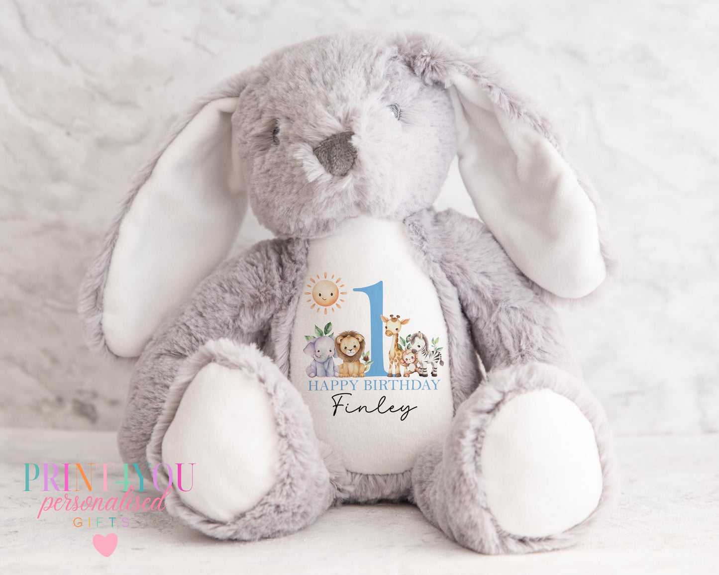 White personalised first birthday bunny soft toy with safari design printed on tummy