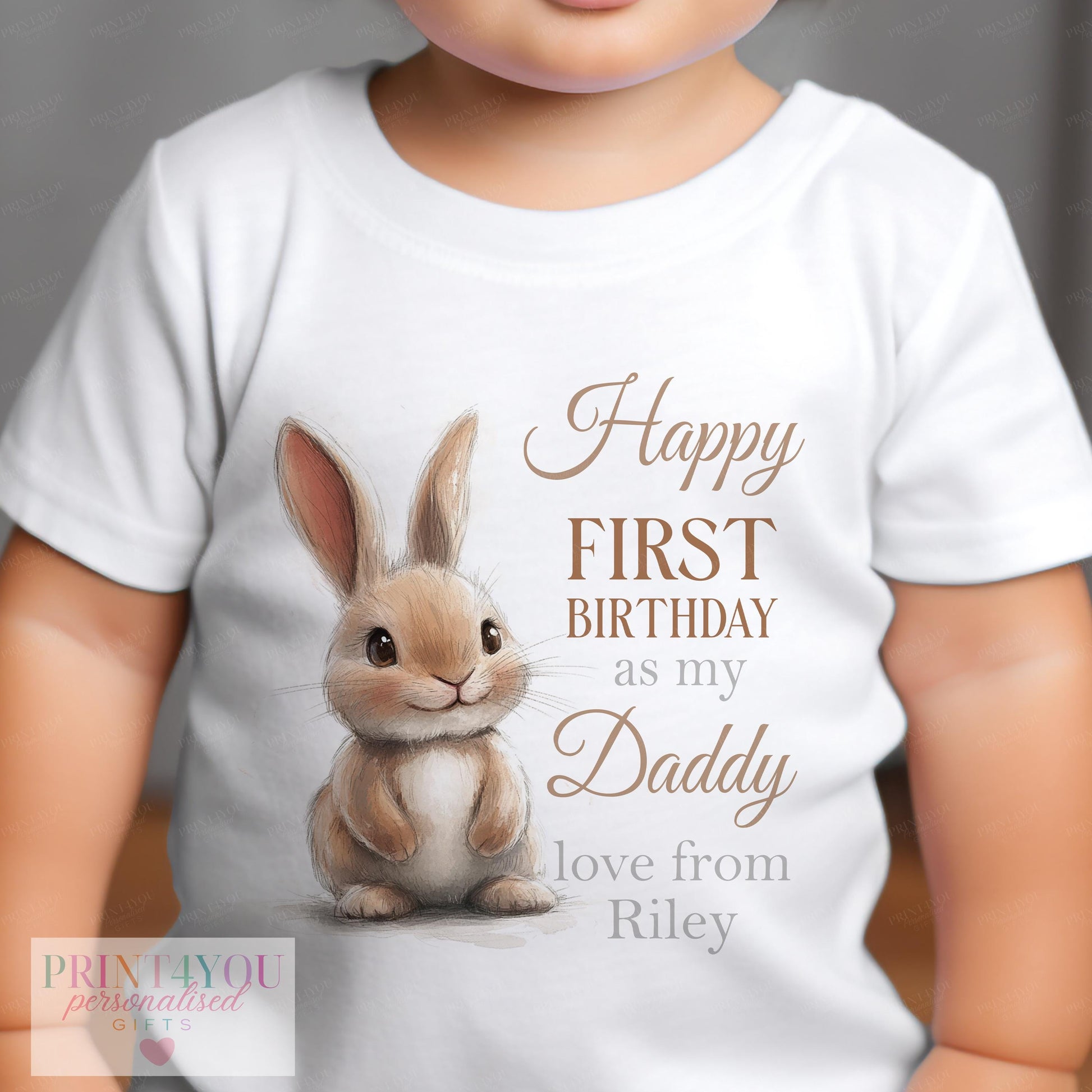 Close-up of the watercolour Daddy Bunny design and brown script name on a personalised first birthday baby vest.