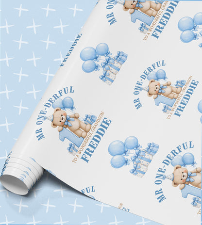 Personalised Mr One-Derful 1st birthday wrapping paper roll with teddy bear, blue balloons and the name Freddie