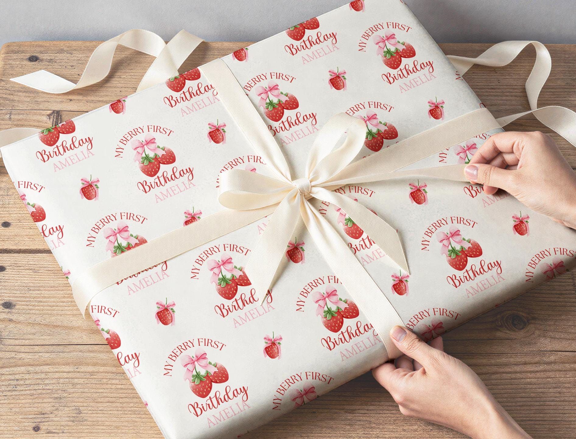 Section of the personalised strawberry wrapping paper showing the strawberry print and personalisation