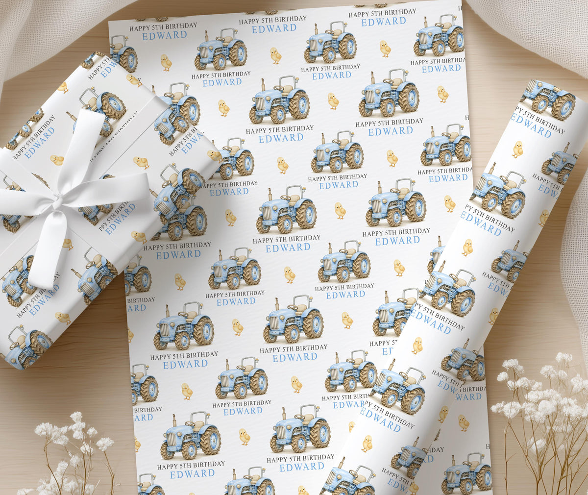 Close-up detail of the personalised blue tractor wrapping paper pattern
