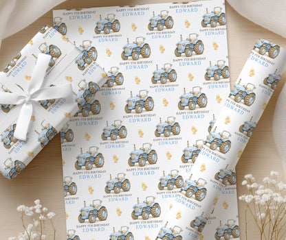 Close-up detail of the personalised blue tractor wrapping paper pattern