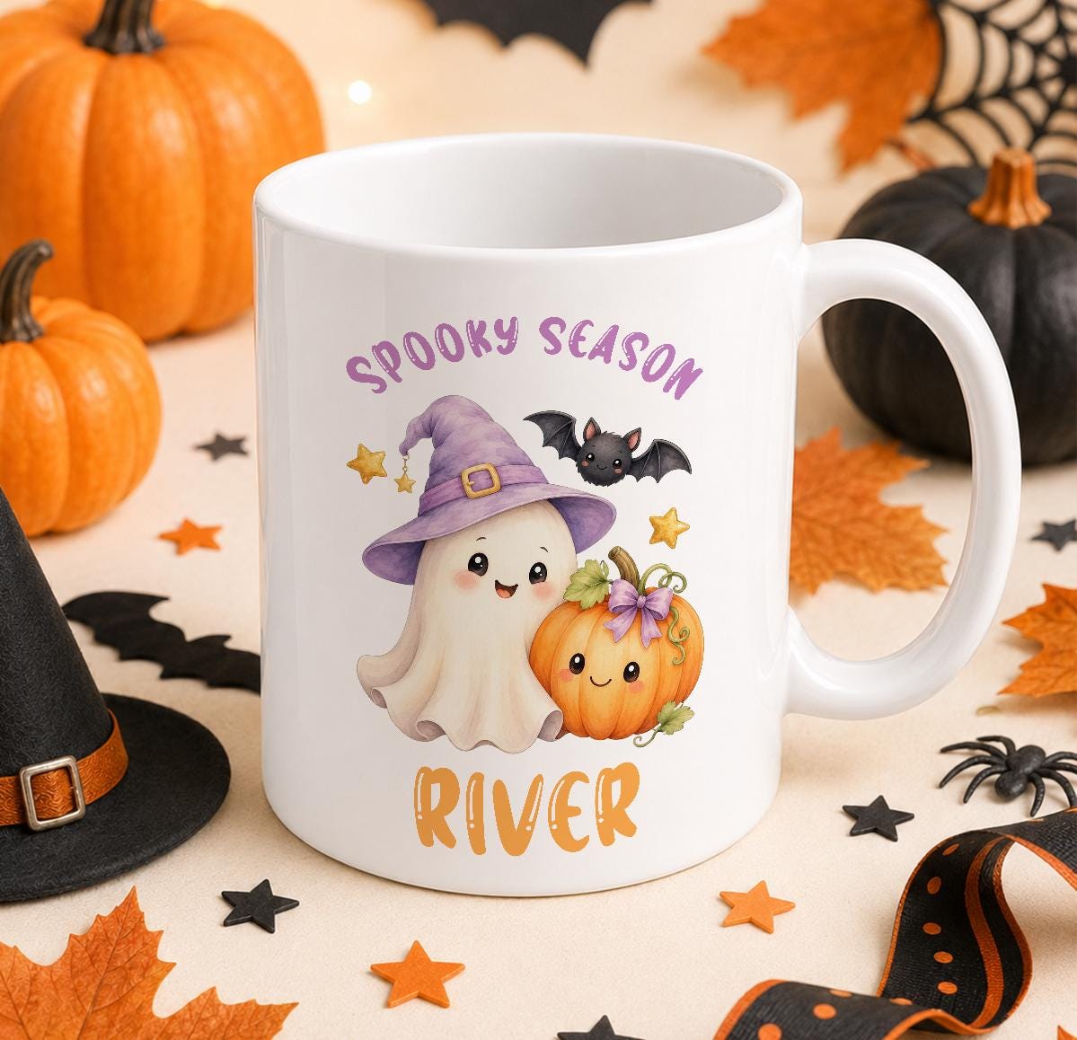 Personalised Halloween mug, white ceramic mug printed with a ghost in a purple witch hat, a pumpkin and a bat with Spooky Season and a name