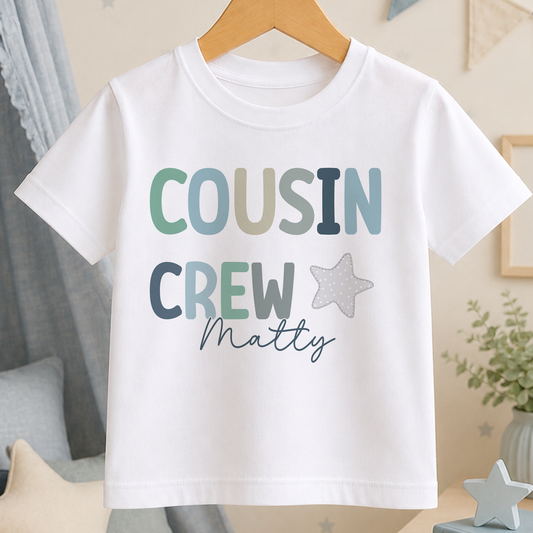 A white t-shirt with the text "COUSIN CREW Matty" printed on it.