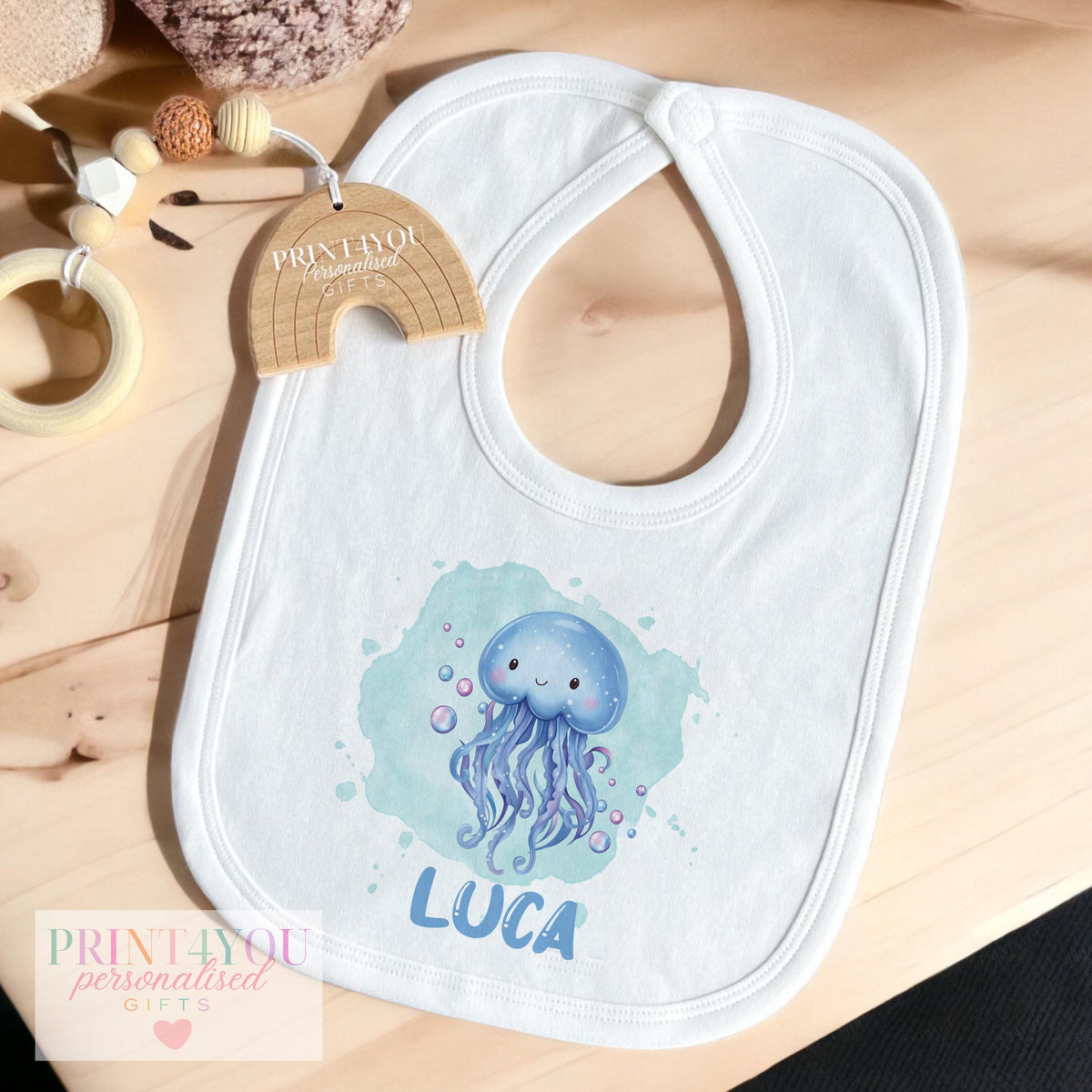 Personalised jellyfish t-shirt for babies and toddlers, printed with custom name and ocean-theme design.
