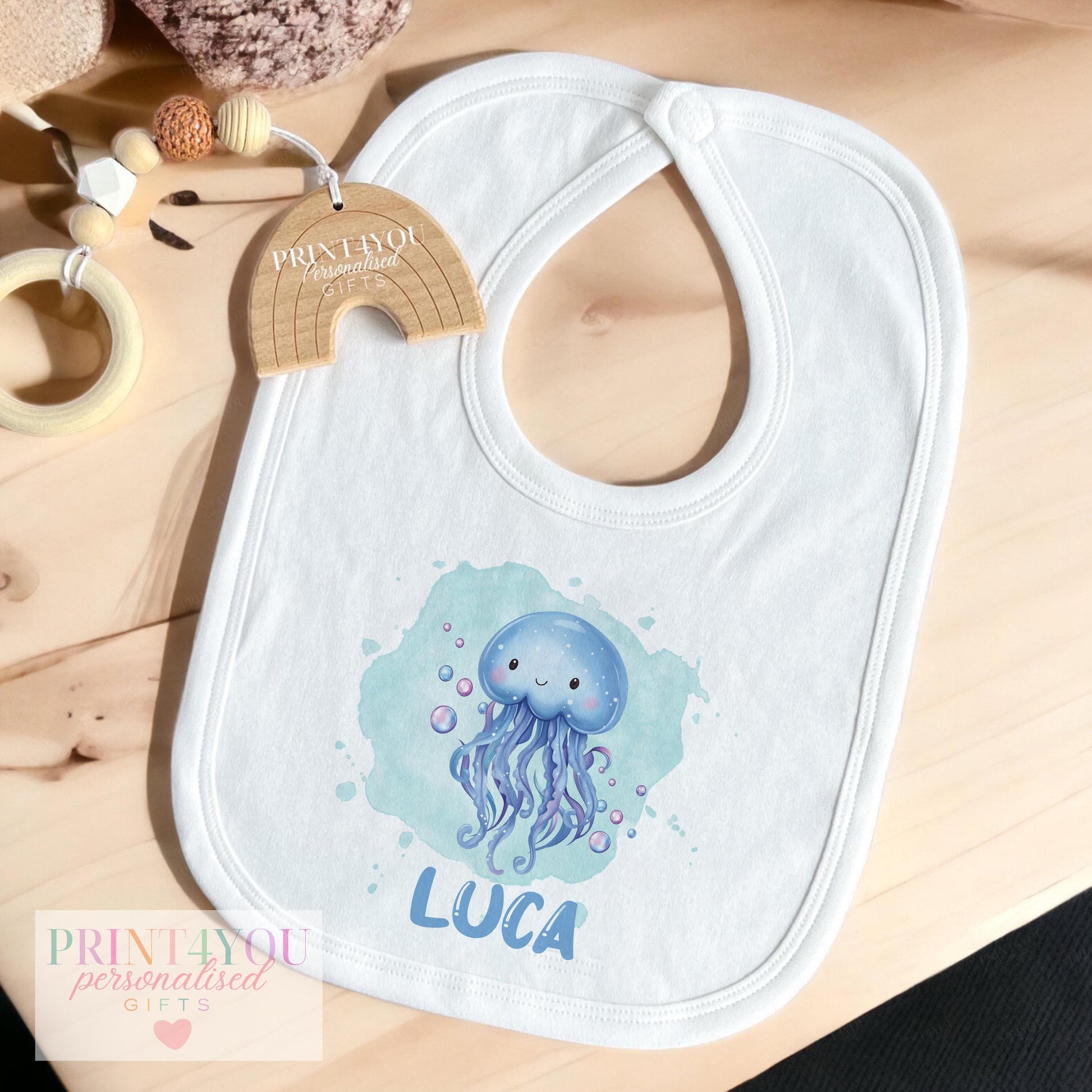 Personalised jellyfish t-shirt for babies and toddlers, printed with custom name and ocean-theme design.