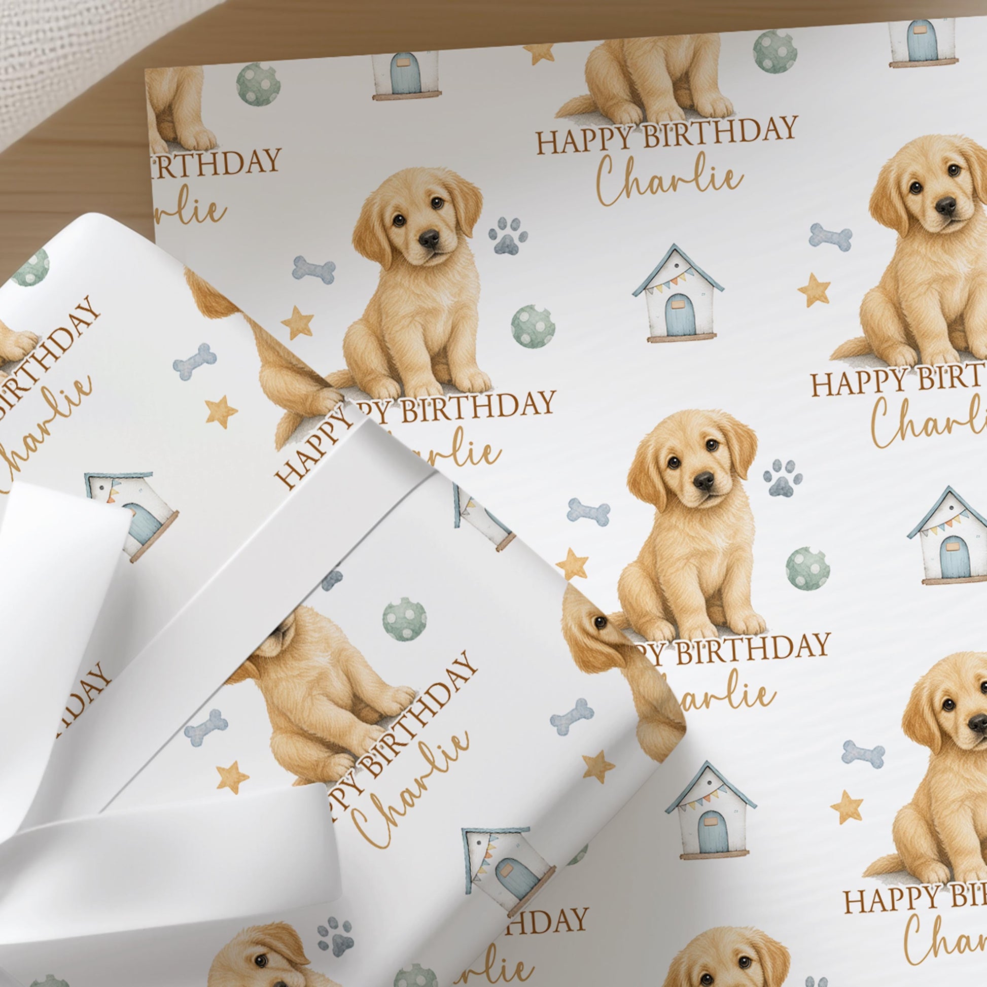 Roll of personalised Golden Retriever wrapping paper shown rolled and ready, with the repeating puppy and birthday pattern visible.