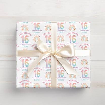 Roll of personalised rainbow wrapping paper packaged in a postal tube ready for delivery.