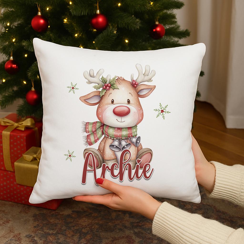 Personalised Reindeer Christmas cushion cover with custom name, reindeer in a striped scarf with holly design