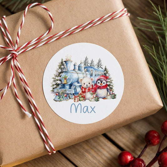 Personalised winter train sticker with penguin, polar bear and custom name on a wrapped Christmas gift