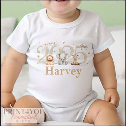 Personalised 'Born in 2025' safari animal bib with baby's name printed on soft white cotton.