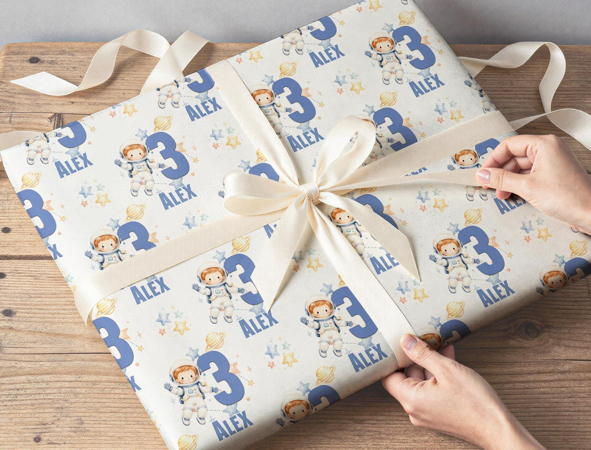 Roll of the personalised astronaut wrapping paper packaged ready for postal delivery.