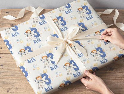 Roll of the personalised astronaut wrapping paper packaged ready for postal delivery.
