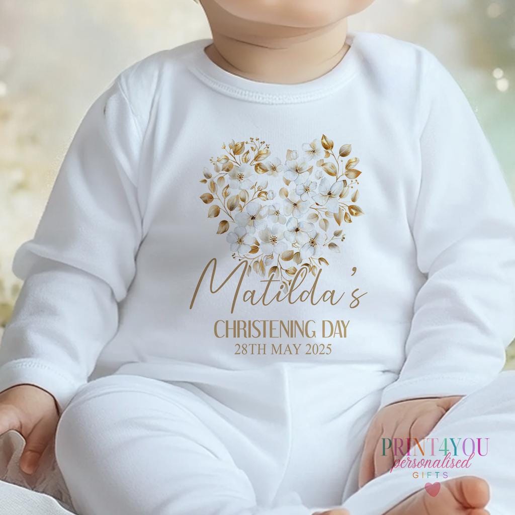 Personalised christening baby outfit, flat lay of sleepsuit and bib