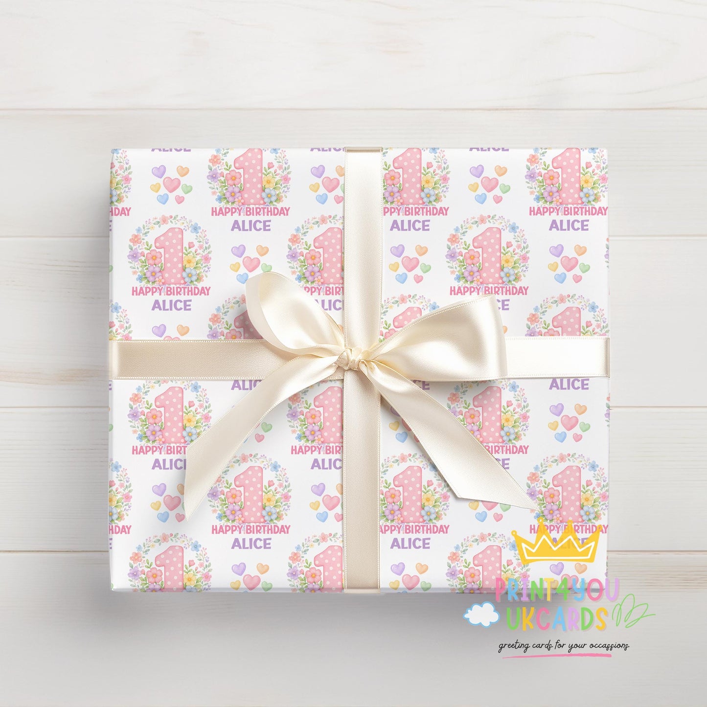 Personalised blossom number wrapping paper shown wrapped around a gift box to demonstrate the finished look.