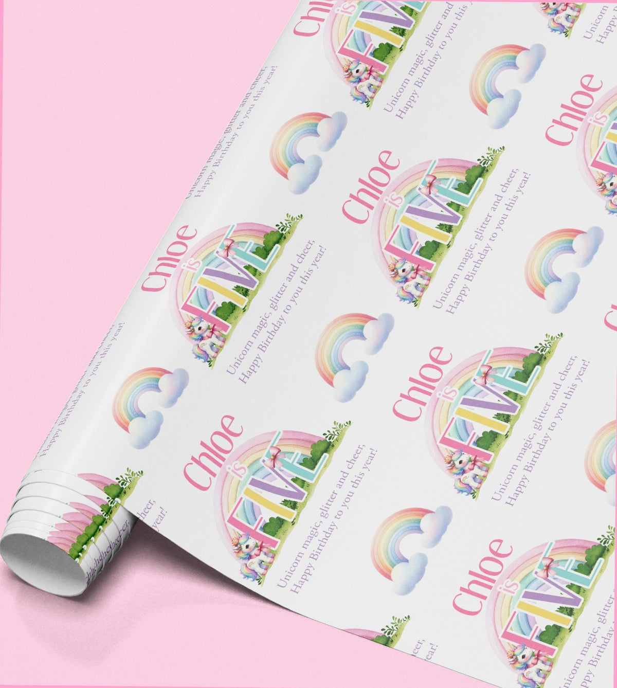 Roll of pink rainbow unicorn wrapping paper personalised with the name Chloe.