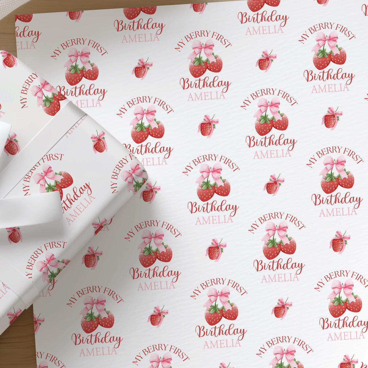 Personalised strawberry first birthday wrapping paper with custom name for baby girl 1st birthday gifts.