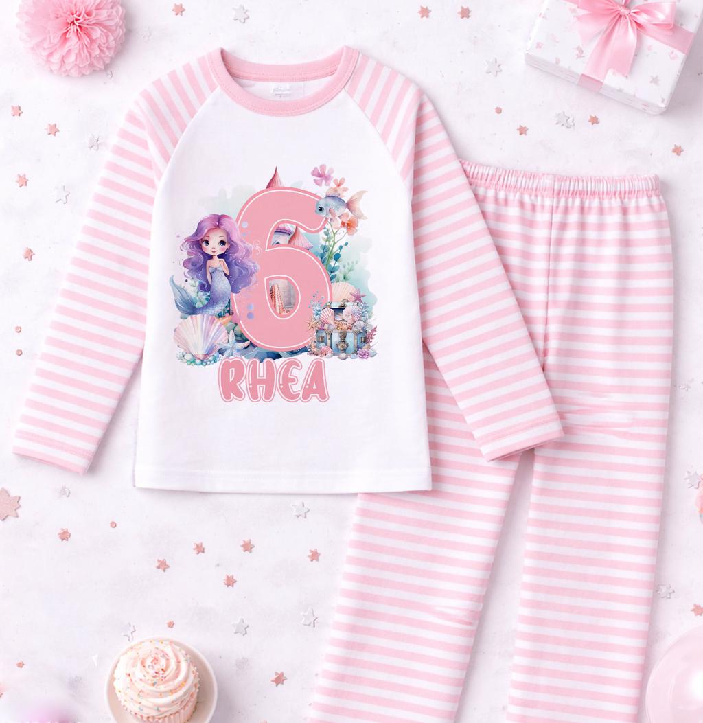 Front view of pink mermaid pyjama set showing the personalised birthday design