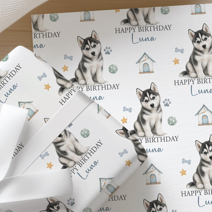 Personalised Husky wrapping paper sheet laid flat showing the full repeating husky puppy and paw print pattern with name.