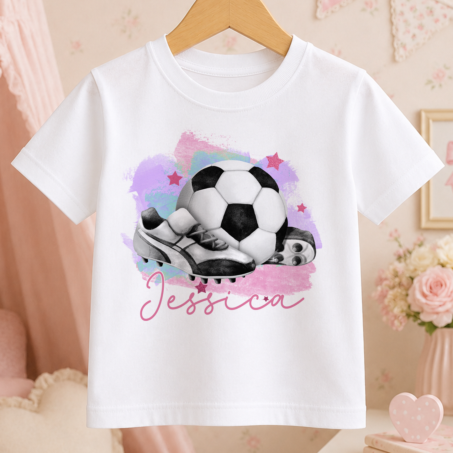 A white t-shirt with a printed design of a soccer ball and cleats, along with the name " Jessica" written below the image.
