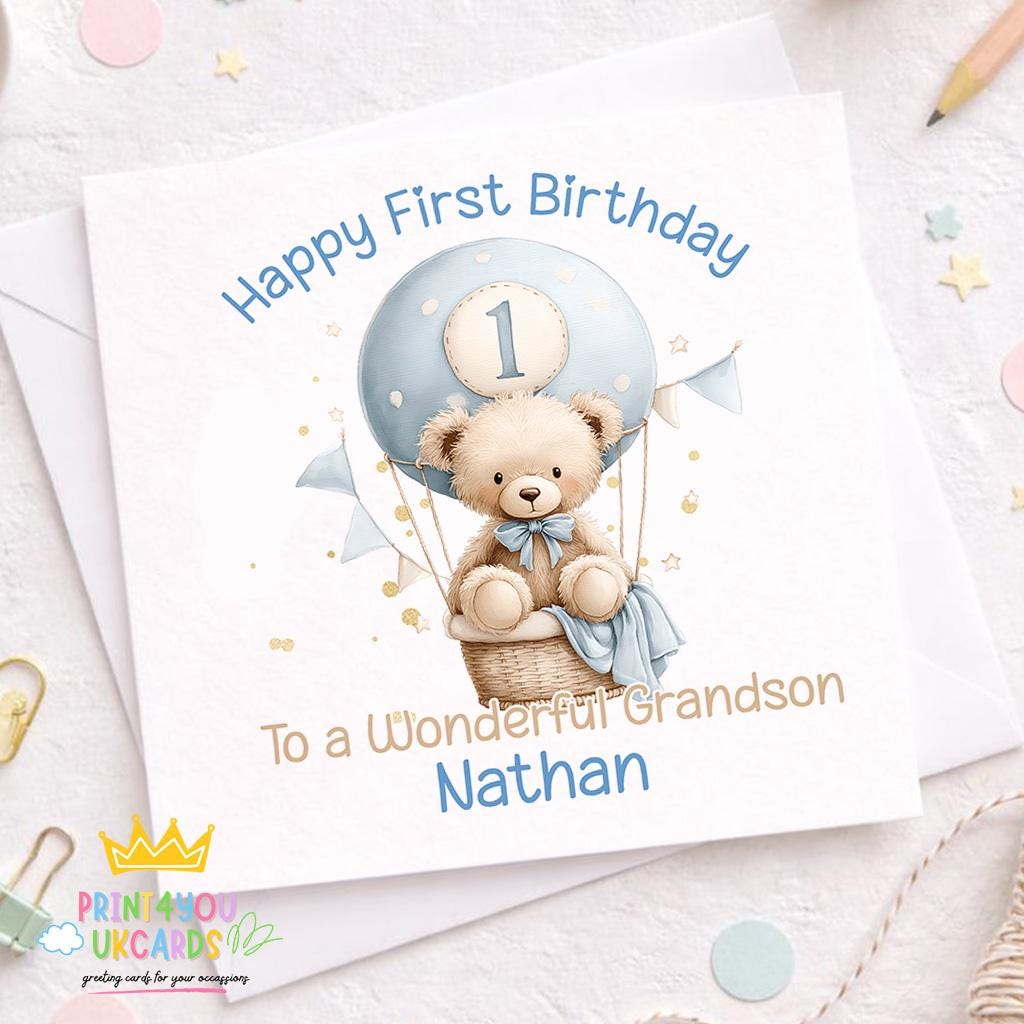 Front view of the teddy bear and hot air balloon 1st birthday keepsake card on a plain background.
