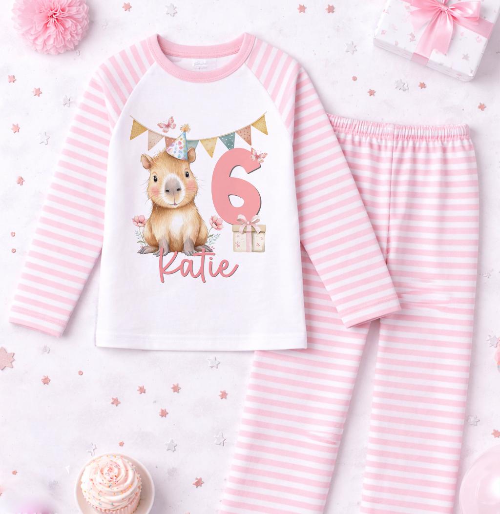 Close-up of the pink stripe design on personalised girls 6th birthday pyjamas