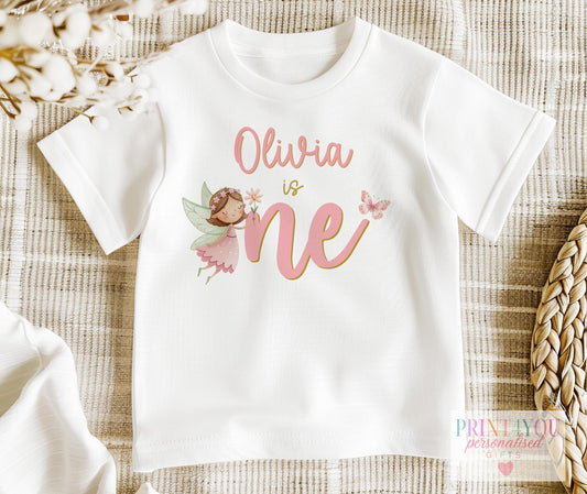 Personalised pink fairy first birthday vest printed with child's name and 'is one'
