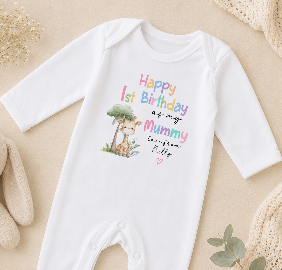 A white onesie with a giraffe and text that says "Happy 1st Birthday as my Mummy love from Nelly" printed on it.