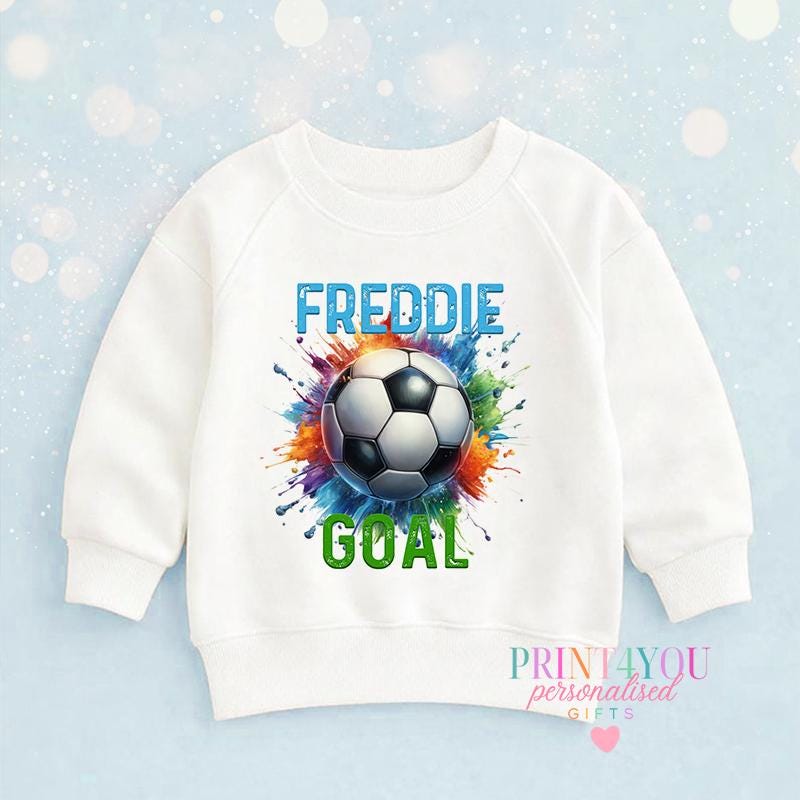 White cotton children's sweatshirt printed with a colourful splash football design and personalised name, laid flat.