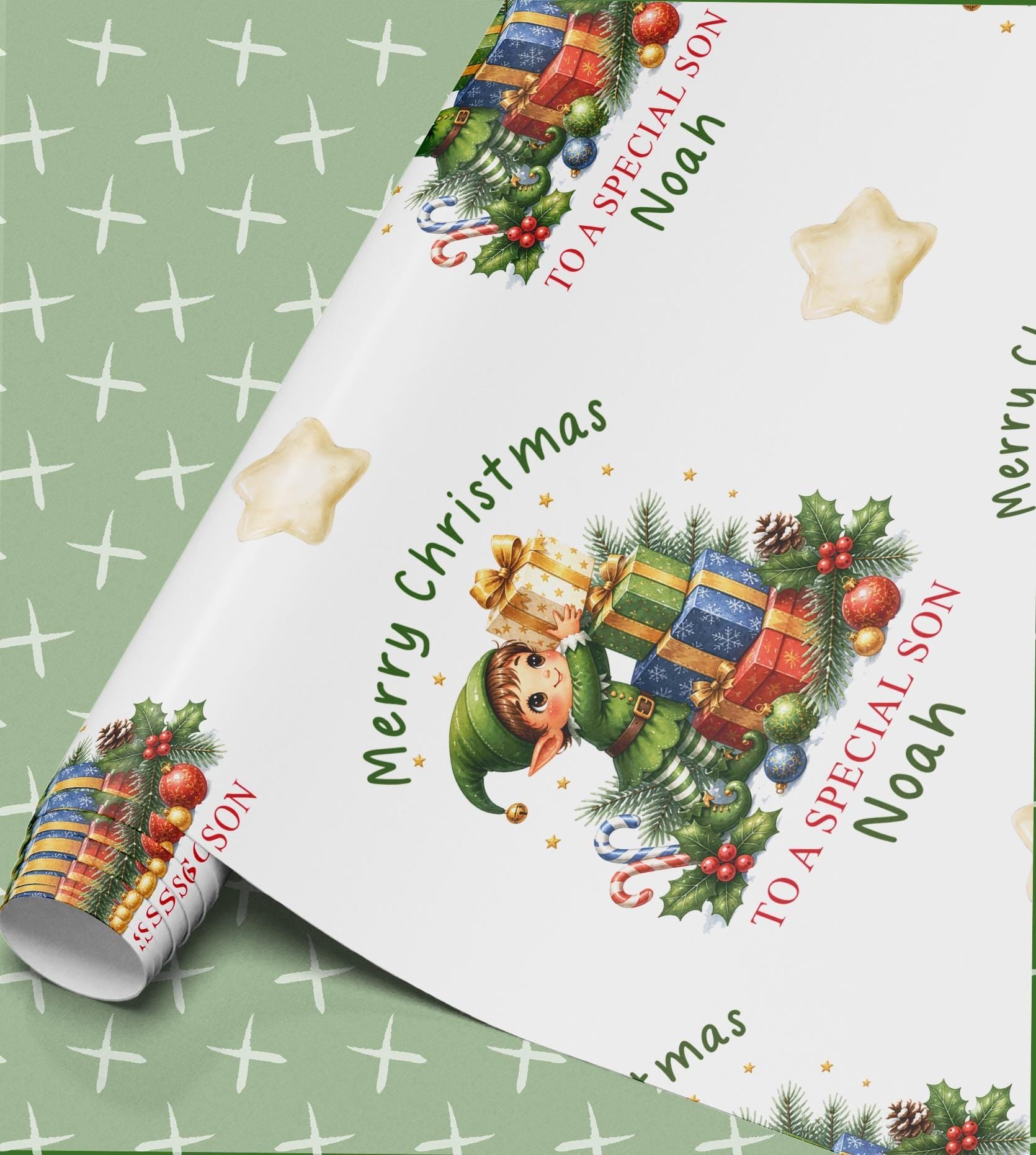 Personalised elf Christmas wrapping paper, part-rolled sheet printed with elves, presents and Merry Christmas with a name
