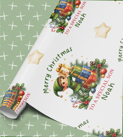Personalised elf Christmas wrapping paper, part-rolled sheet printed with elves, presents and Merry Christmas with a name