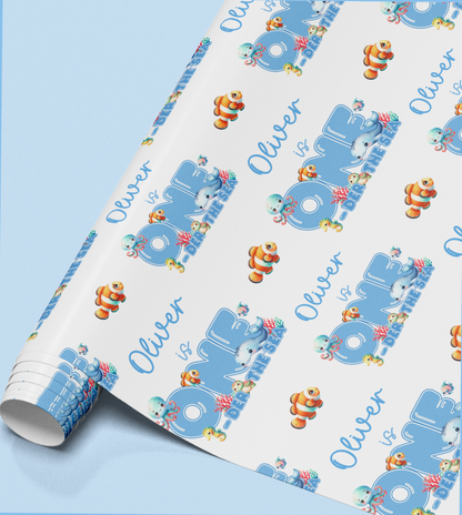 Close-up of the fish and coral pattern printed on the wrapping paper