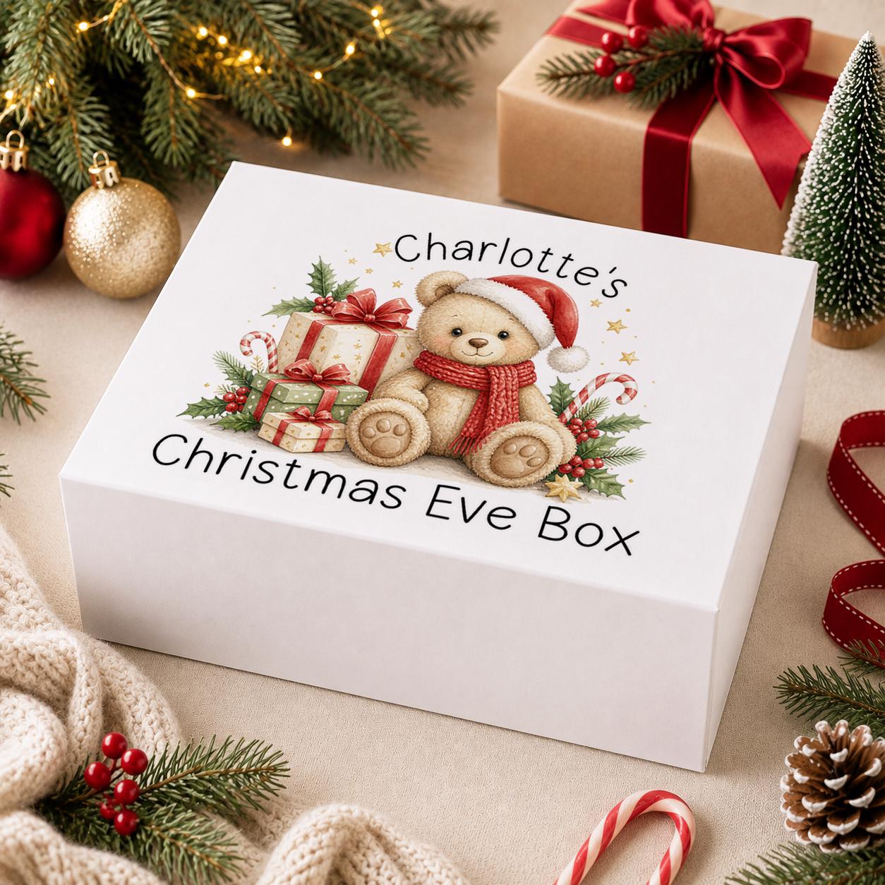 Personalised Christmas Eve box, white magnetic gift box printed with a teddy bear in a Santa hat, red presents and a name above Christmas Eve Box
