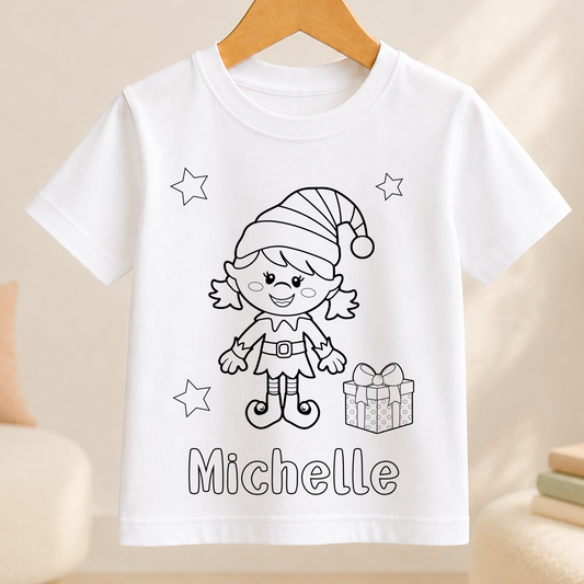 A white t-shirt with a black and white illustration of a smiling elf character and the name "Michelle" written below it.