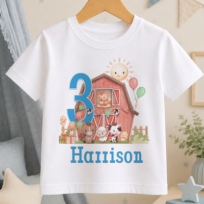 White cotton kids t-shirt printed with a farmyard barn scene, the number 3 and the personalised name 'Harrison'