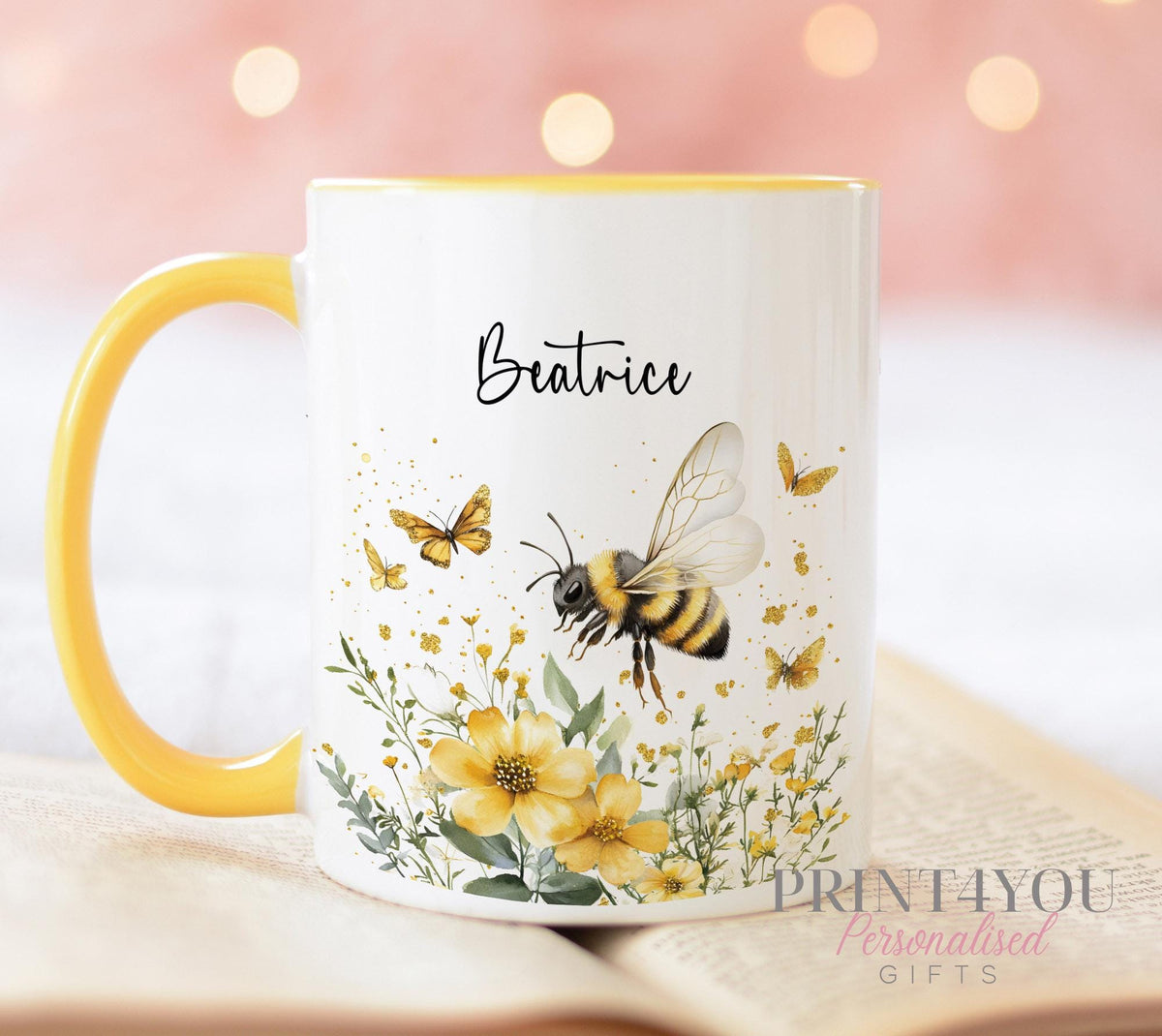 White ceramic mug featuring a personalised bumble bee design with a name printed alongside.