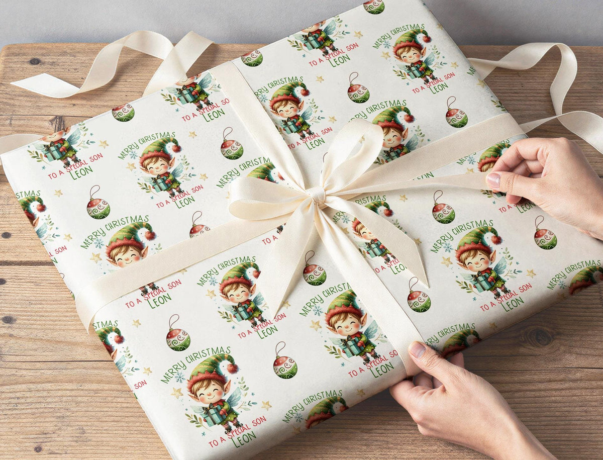 Personalised elf Christmas wrapping paper wrapped around a gift
