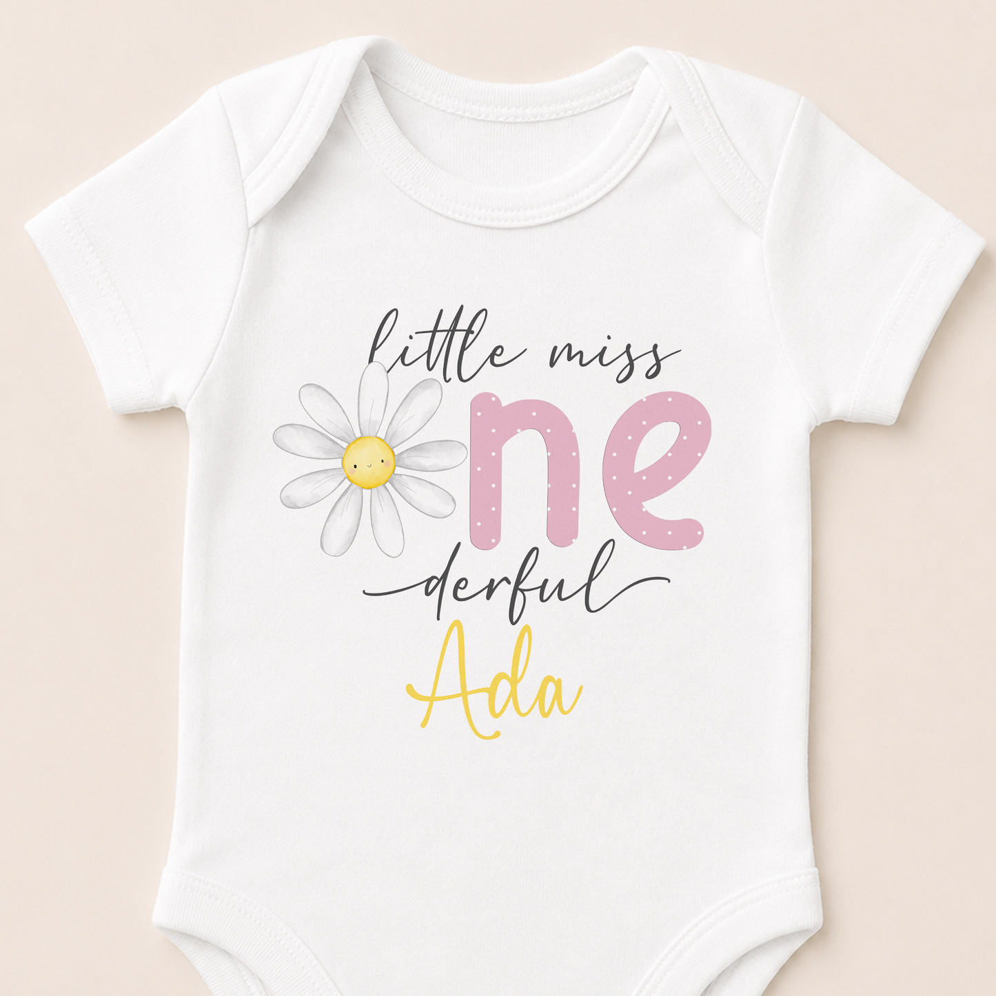 Personalised Little Miss One-derful daisy onesie showing the smiling daisy design and custom name.