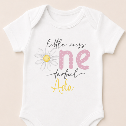 Personalised Little Miss One-derful daisy onesie showing the smiling daisy design and custom name.