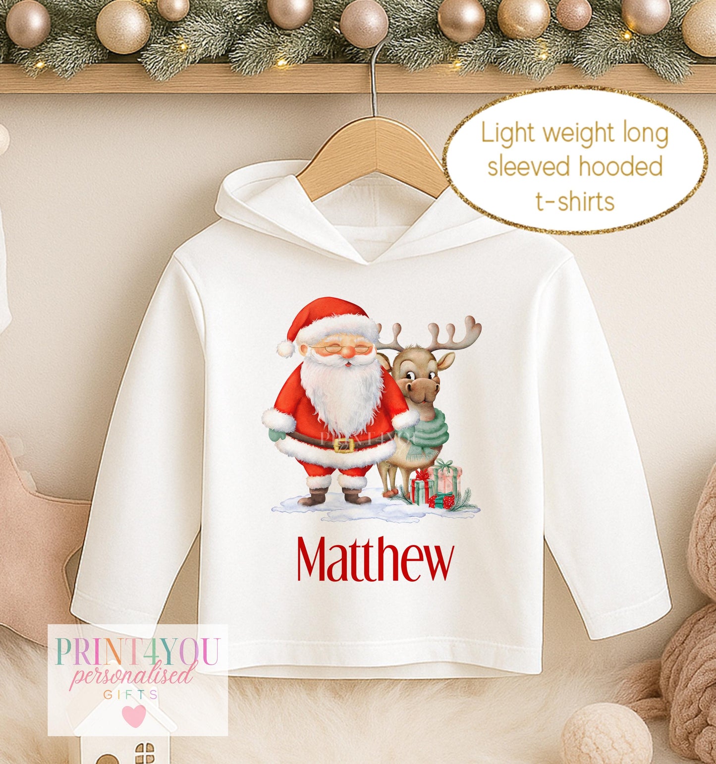 Personalised Christmas hooded t-shirt, white long sleeved hoodie printed with Santa holding a present with a reindeer and a name in red
