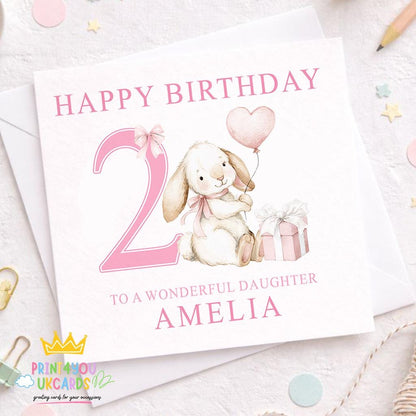 Pink square birthday card with a bunny design, personalised with a child's name and age