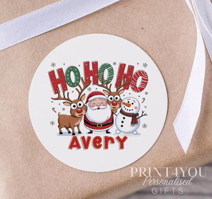 Personalised Santa 'Ho Ho Ho' Christmas sticker in glossy white finish, custom name printed on a strip of 5cm round gift labels