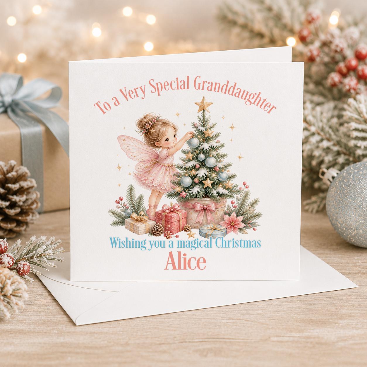 Personalised fairy Christmas card, white 6x6 inch square card printed with a fairy decorating a pink Christmas tree with a name